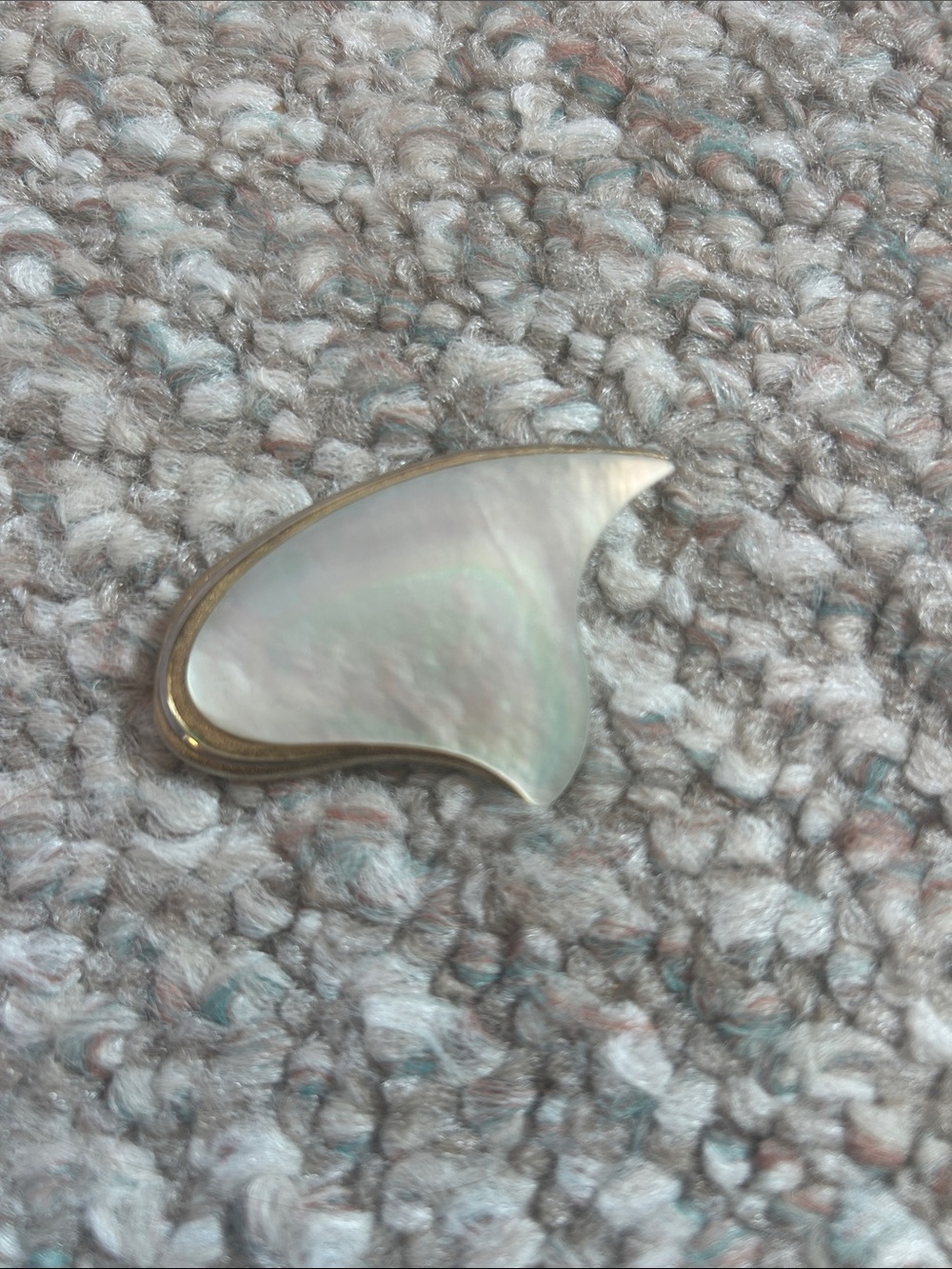 Vintage gold-tone abstract leaf brooch with "GES. GESCH." marking.